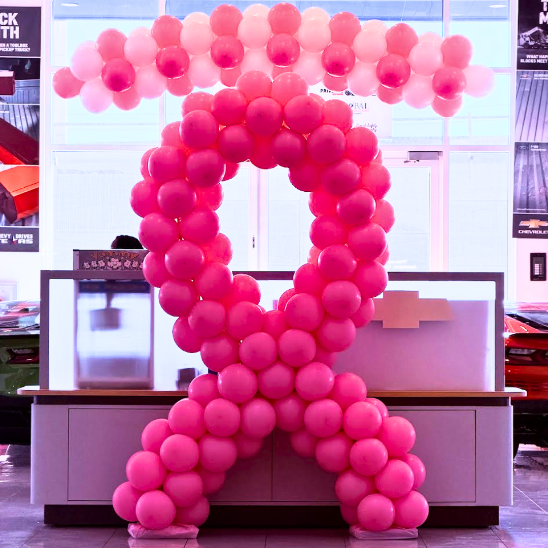 Breast cancer awareness balloon ribbon display