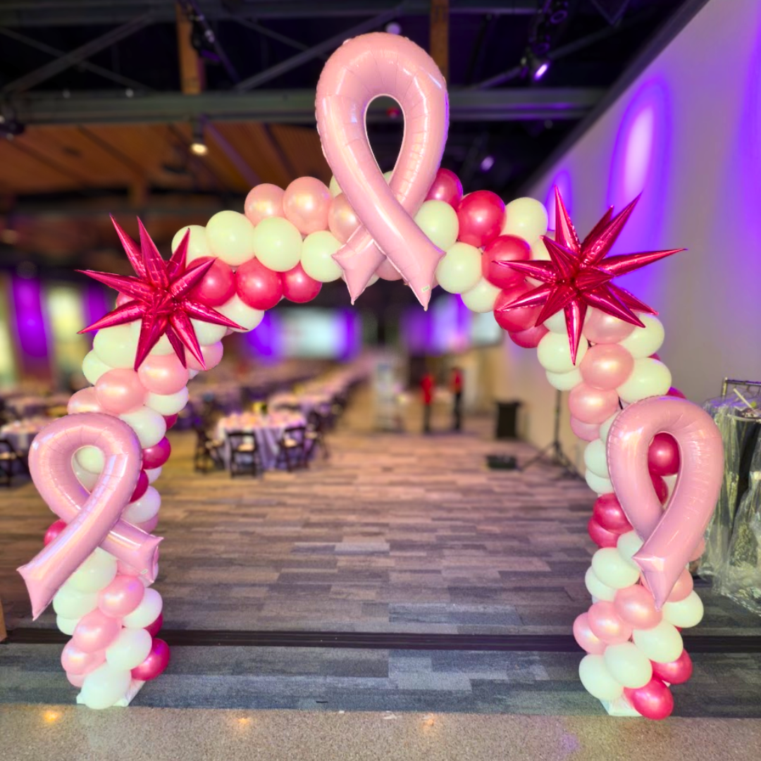 Pink balloon arch for a breast cancer awareness event