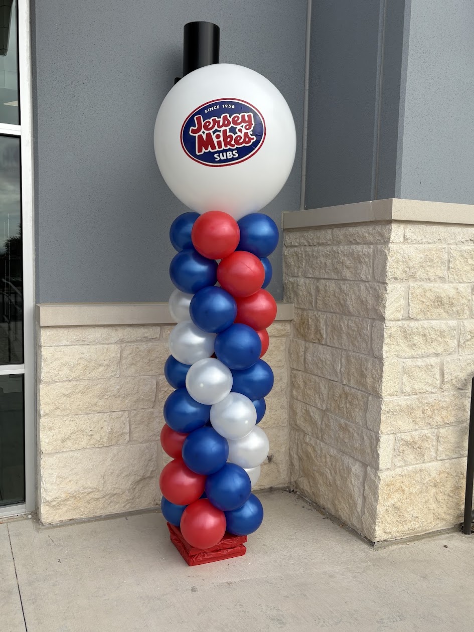 Tall balloon column created by Balloon Man