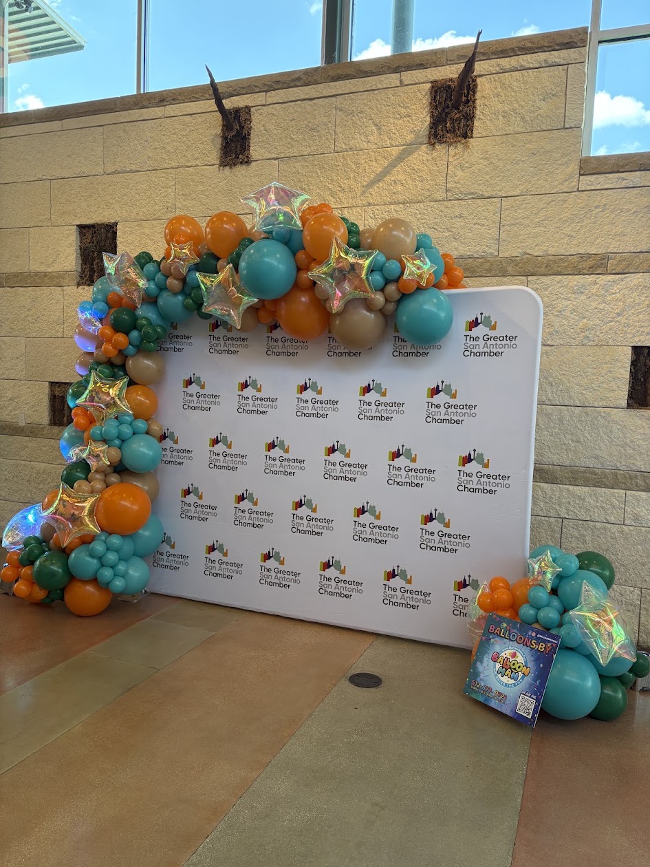 Balloon garland arranged around an event focal area