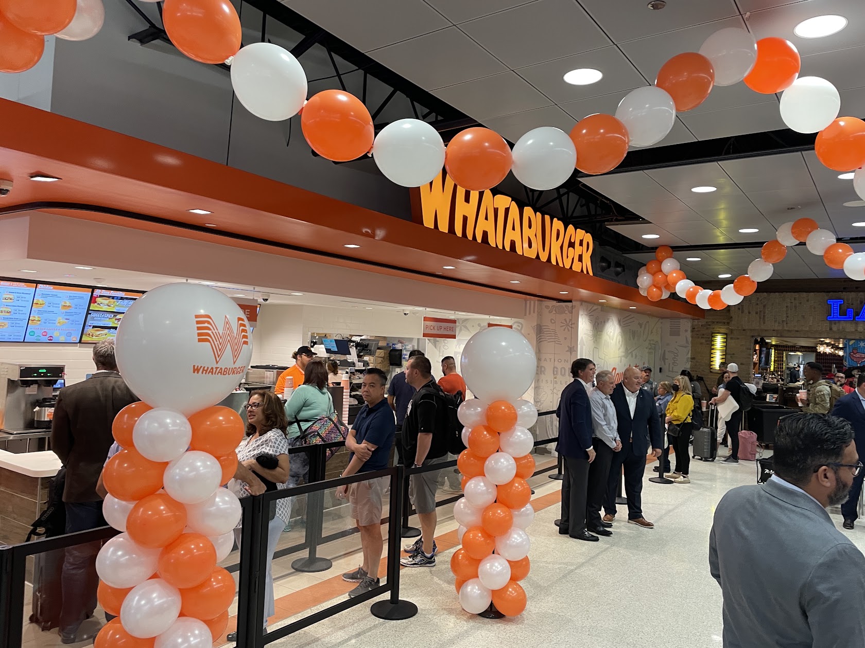 Grand opening balloons in San Marcos service example with branded business decor